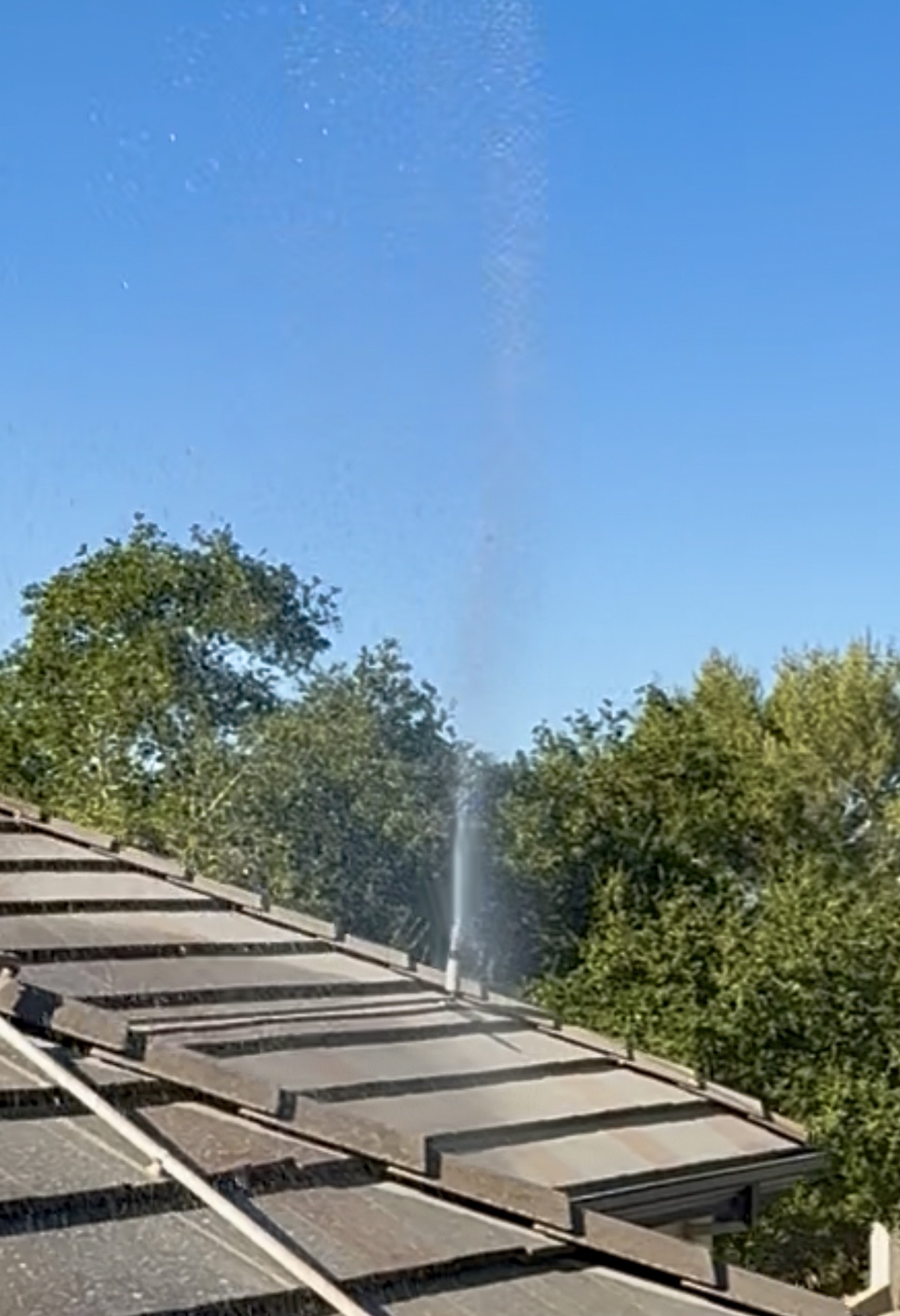 FireRoofs roof sprinkler head spraying water
