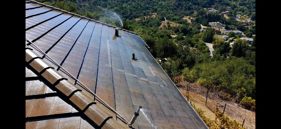 Aerial view of roof-mounted wildfire sprinklers covering an entire roofline